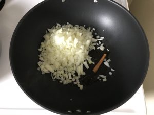 Onion and cinnamon stick to frying pan